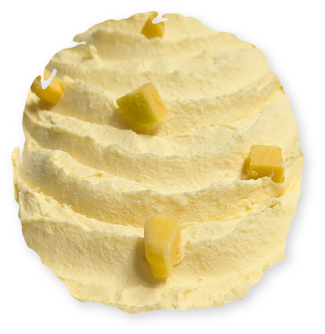 Whipped yellow dessert with yellow cubed garnish.