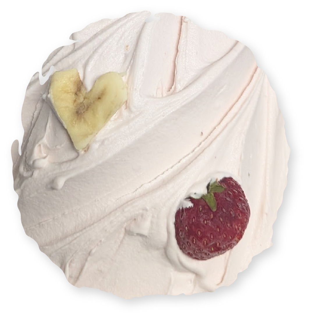 Pink dessert with strawberry and banana heart.