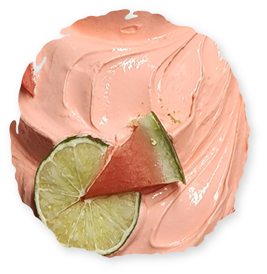 Pink swirled cream with lime slice and watermelon wedge.