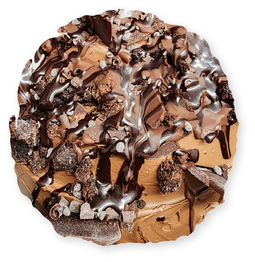Chocolate ice cream sundae with brownies, chocolate chips, and sauce.