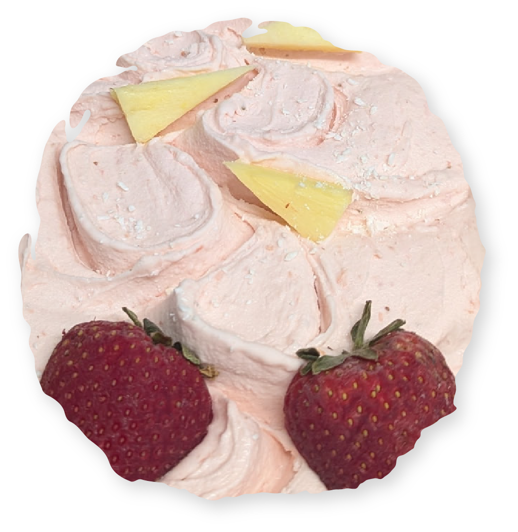 Cupcake with pink frosting, strawberries, and yellow cheese.