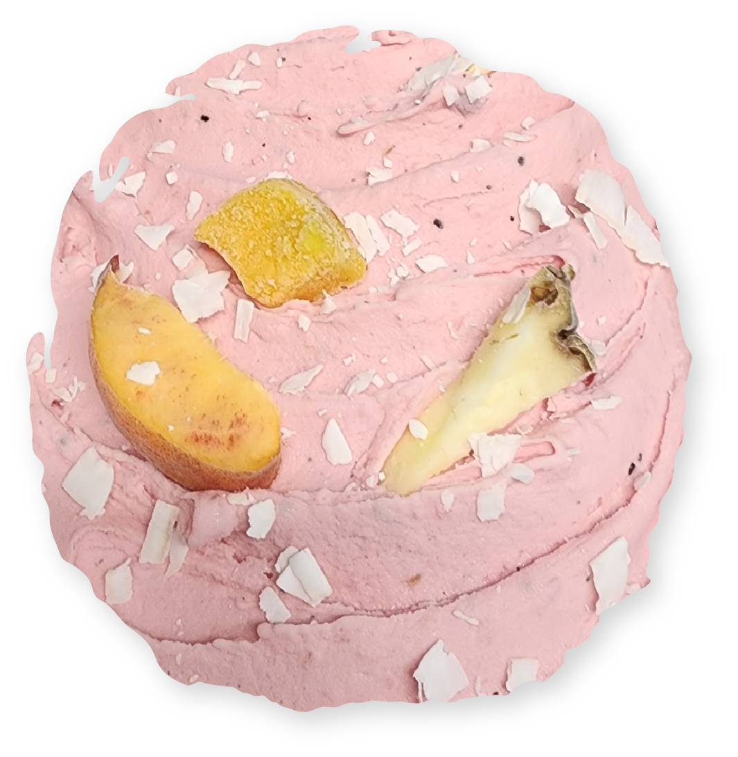Pink frosted cupcake with candied fruit and coconut flakes.