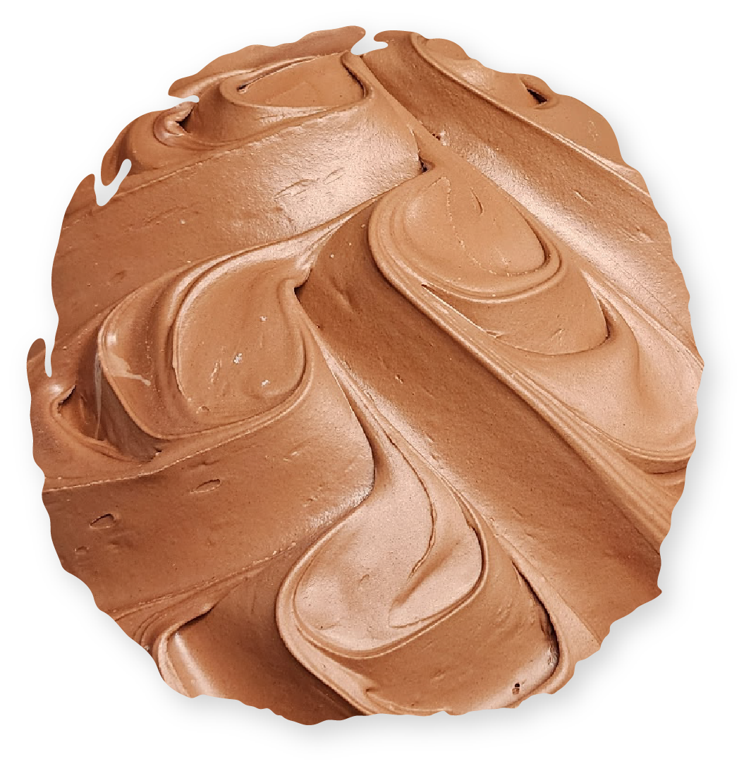 Chocolate frosting swirled on a round surface, light brown and dark brown shades.