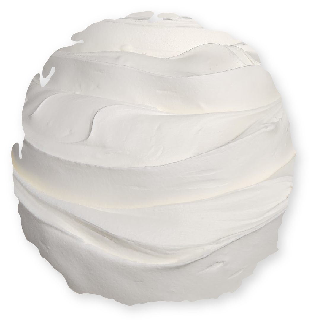 White, swirled frosting piled high, shaped into a spherical form.
