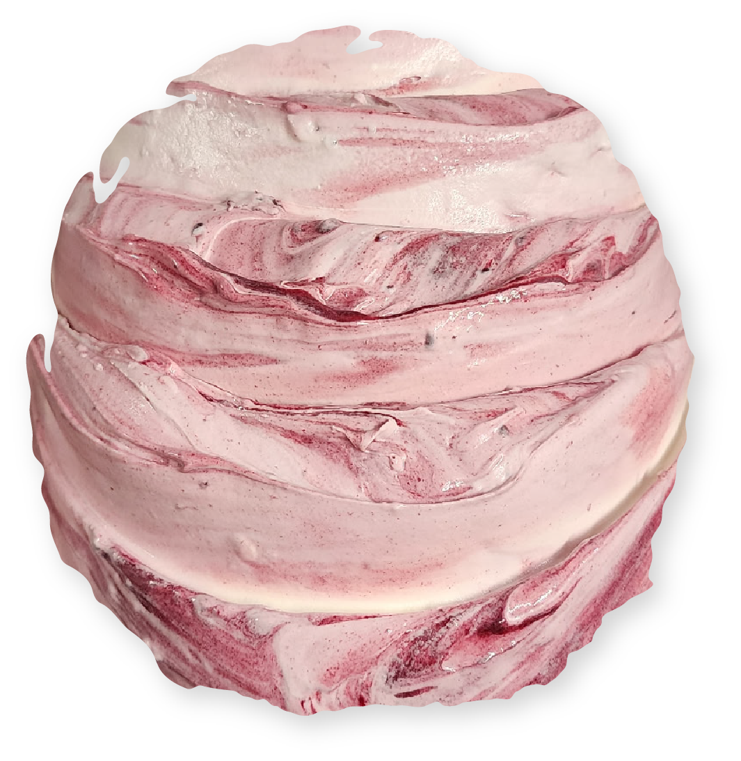 Swirled bath bomb with pink and white layers.