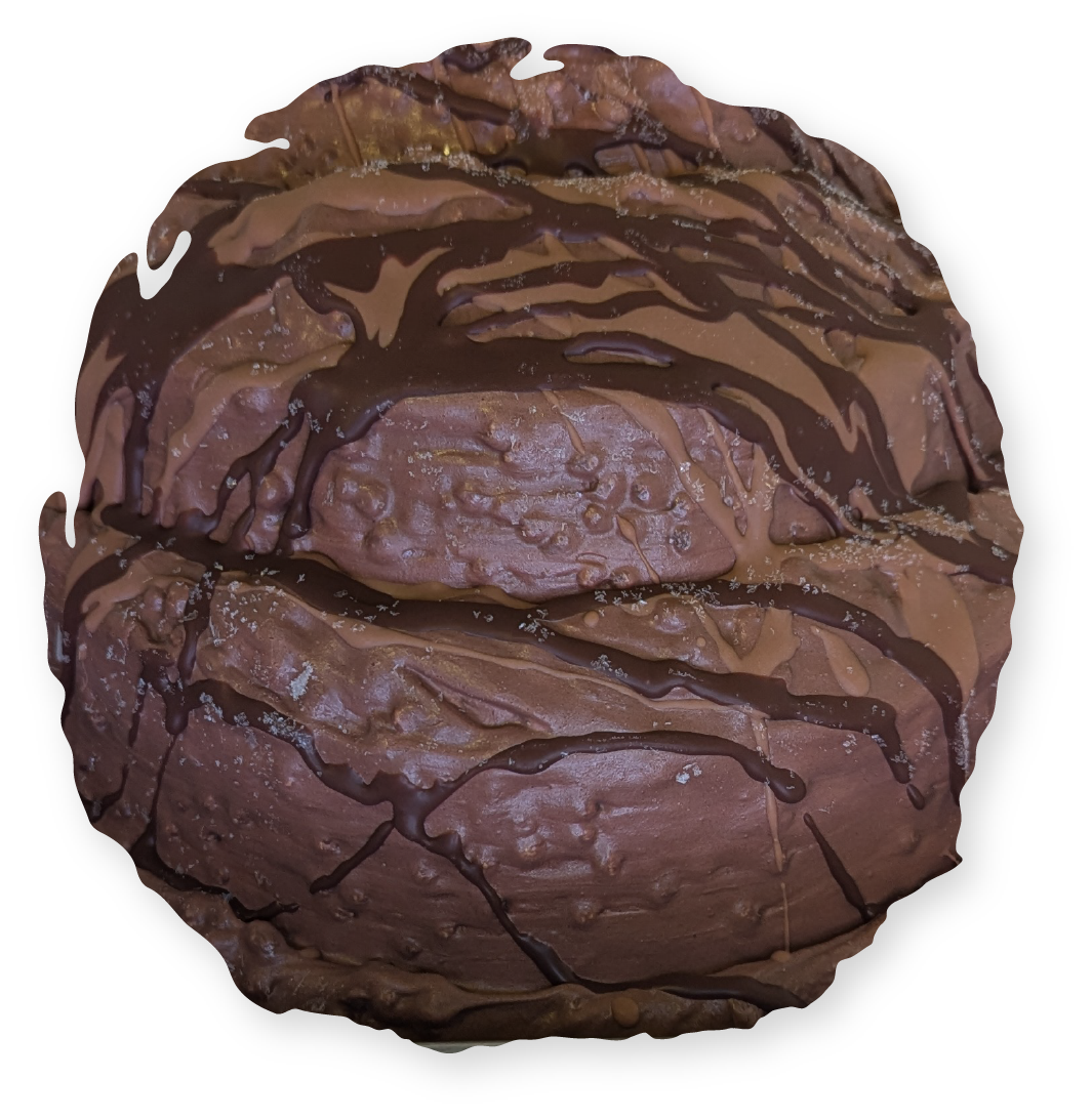 Chocolate glazed dessert. Dark brown with drizzles, textured surface.