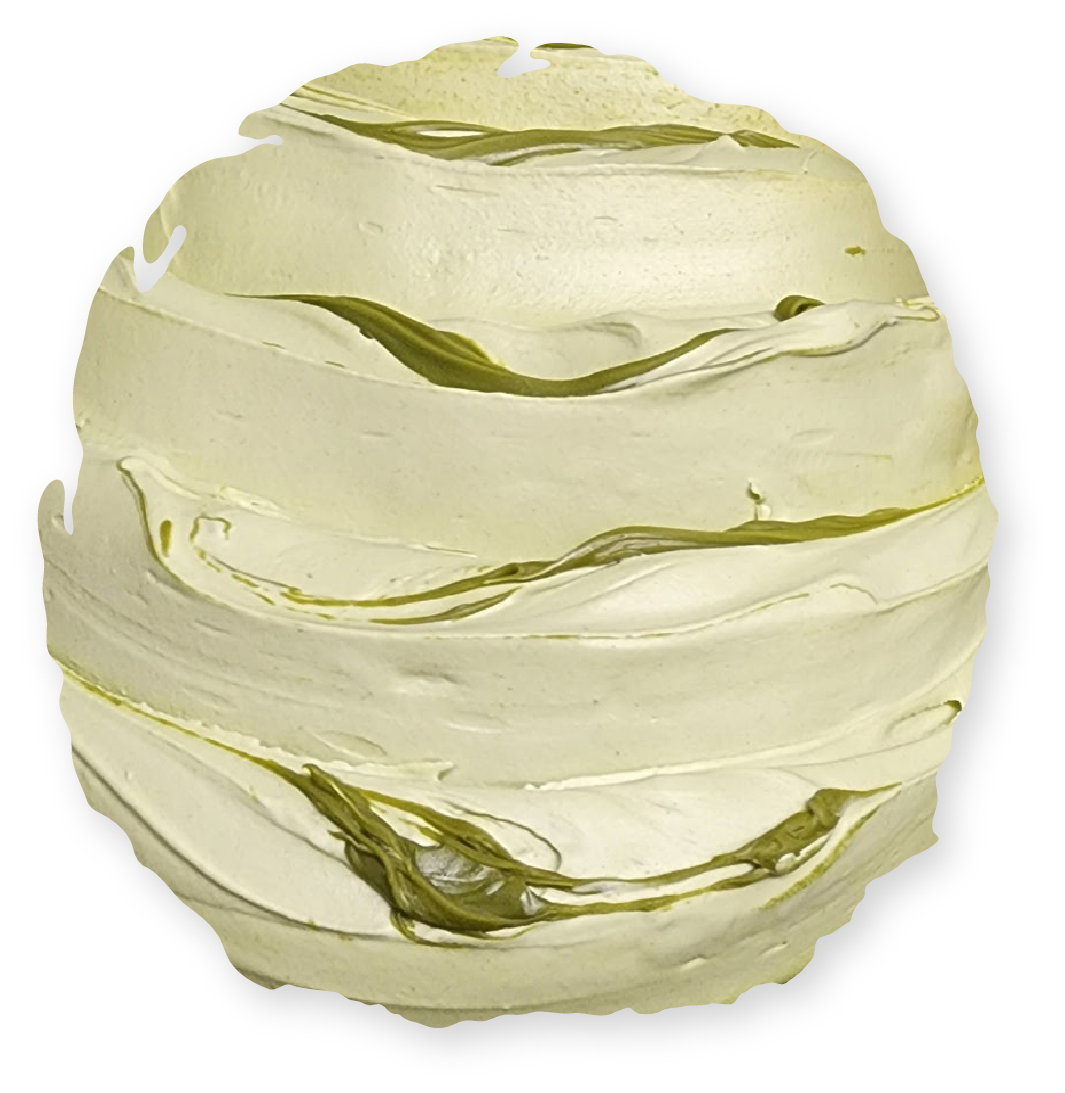 Round cake with textured, cream-colored frosting and streaks of green.