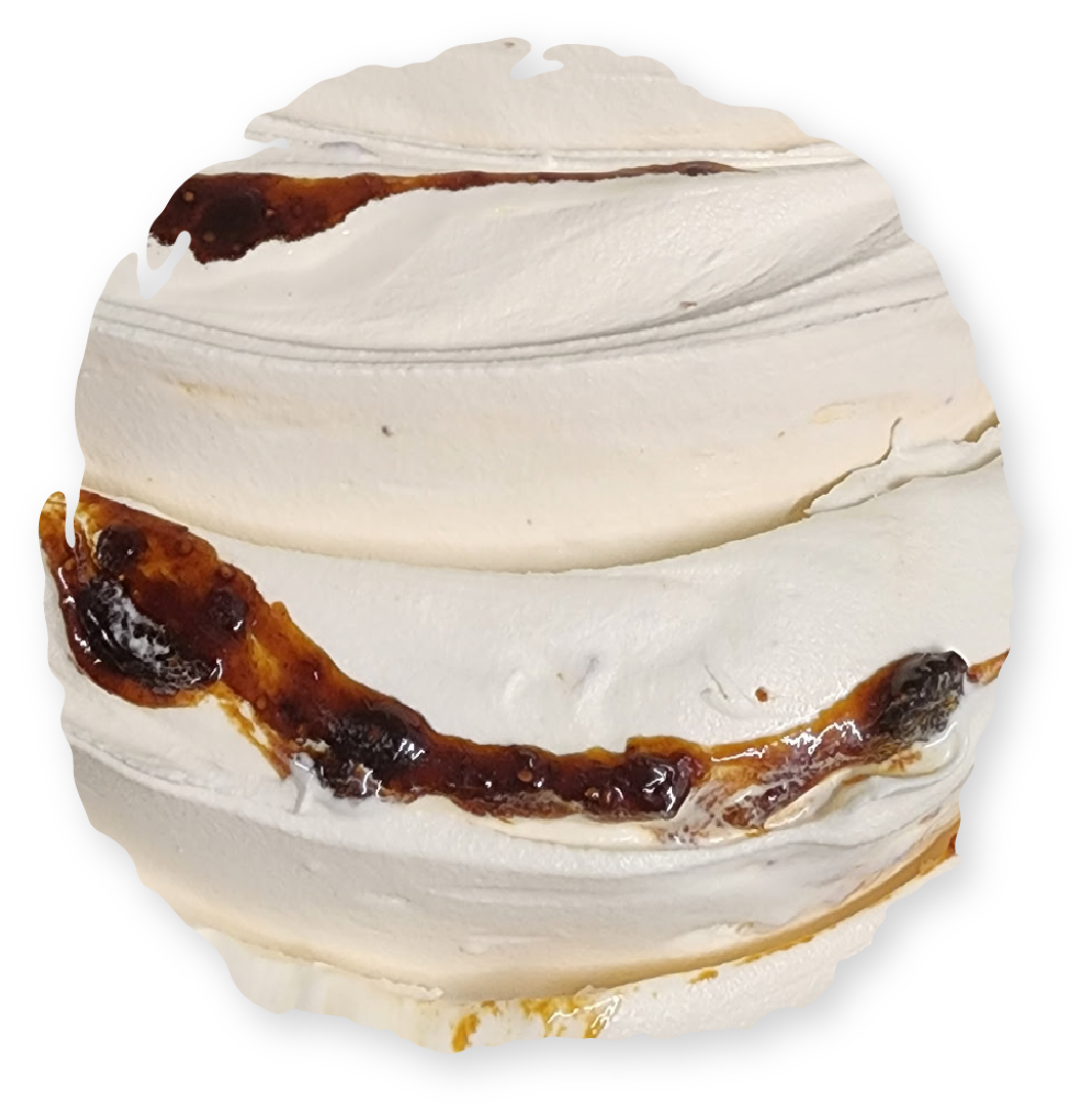 Swirled white meringue with streaks of dark caramel.