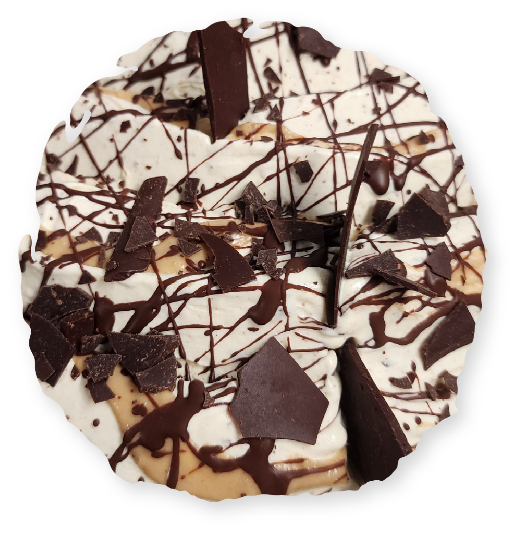 Ice cream dessert, beige and white with dark chocolate drizzle and chunks.