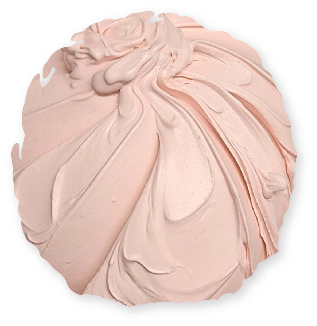 Swirled mass of pale pink frosting on a white background.
