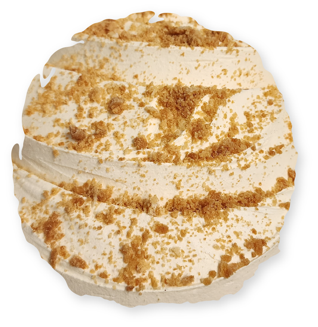Cupcake with beige frosting and brown crumbs.
