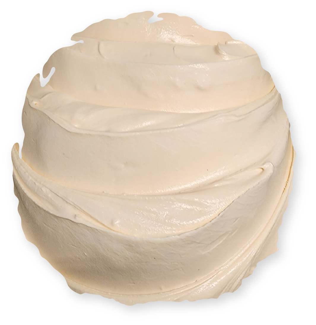 Creamy white frosting, swirled into a round shape.