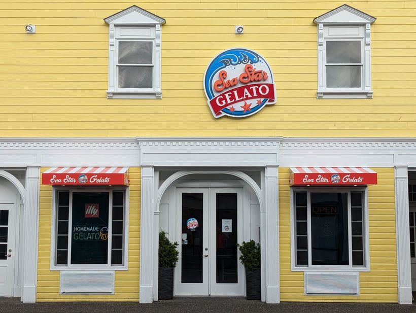 A yellow building with a sign that says Sea Star Gelato on it