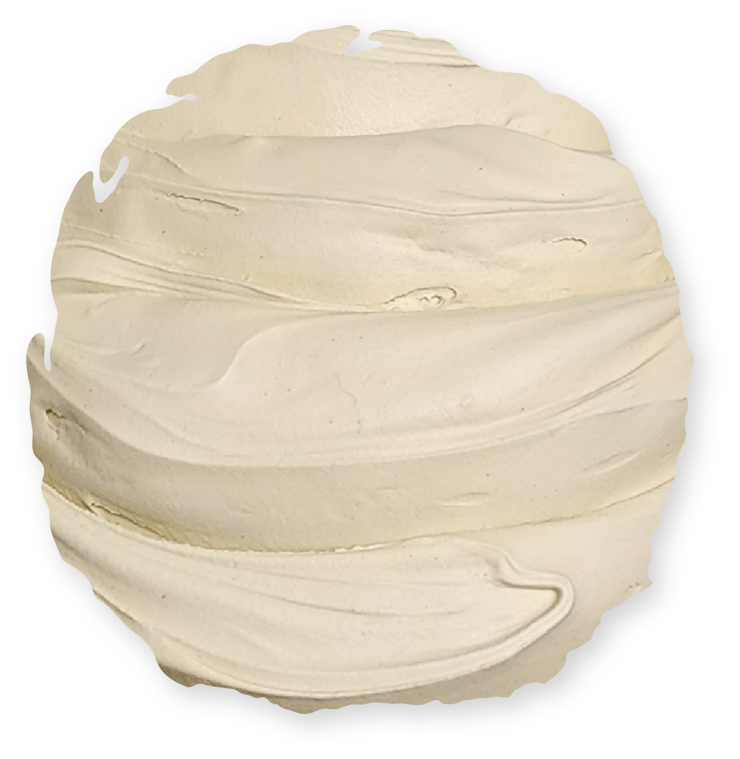 Swirled pale cream frosting on a round surface.