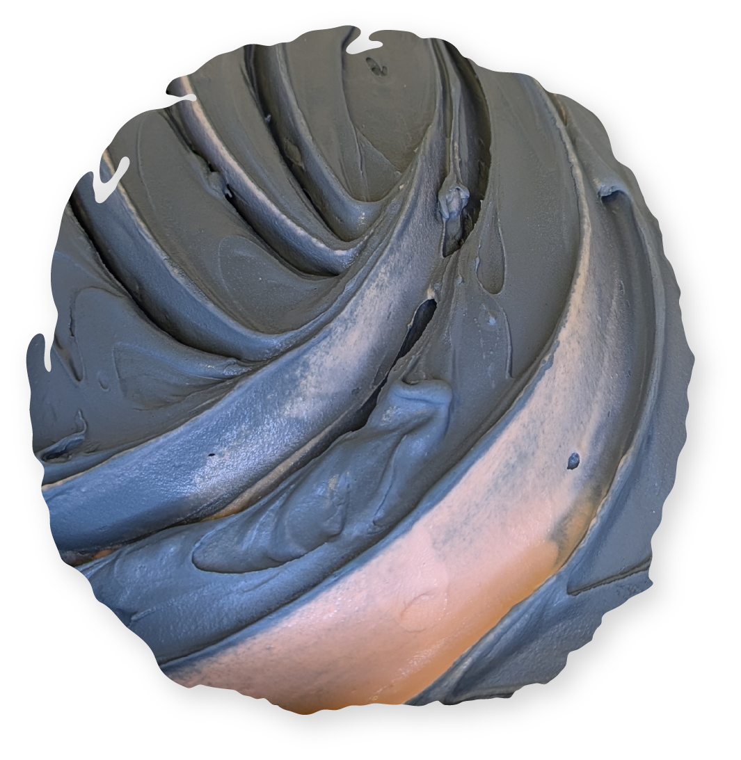 Swirled gray frosting with hints of blue and copper, likely on a dessert.
