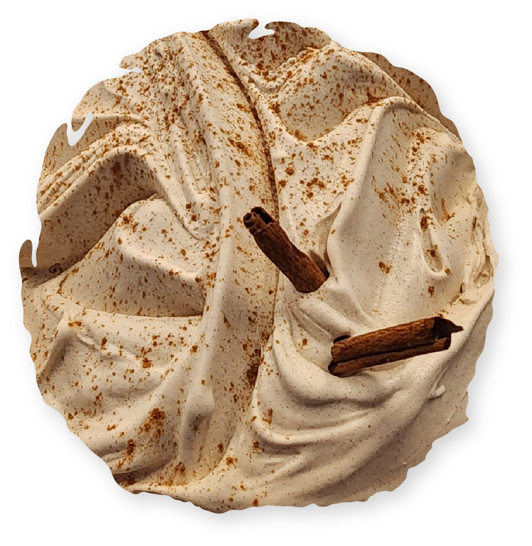 Whipped cream dessert with cinnamon and cinnamon sticks.