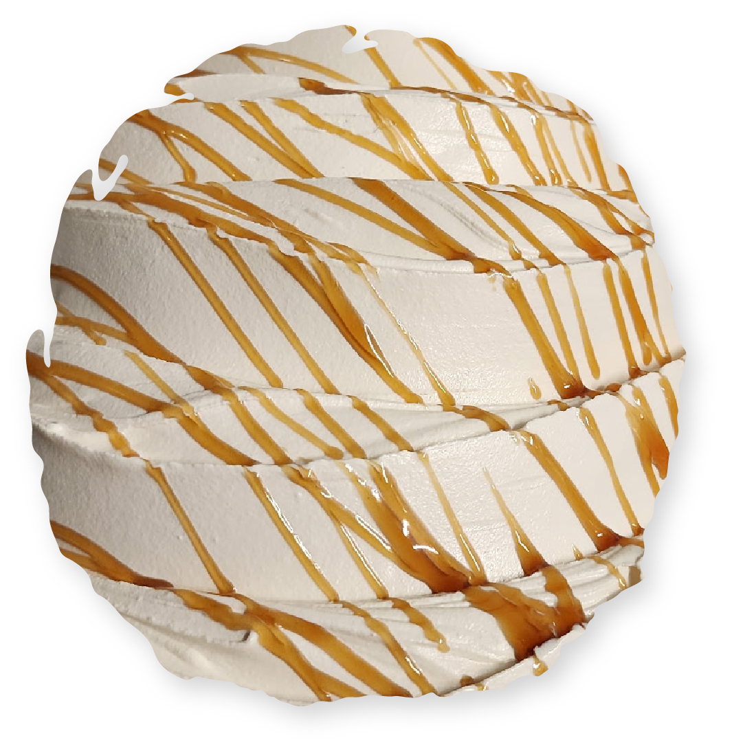 Whipped cream dessert with caramel drizzle.