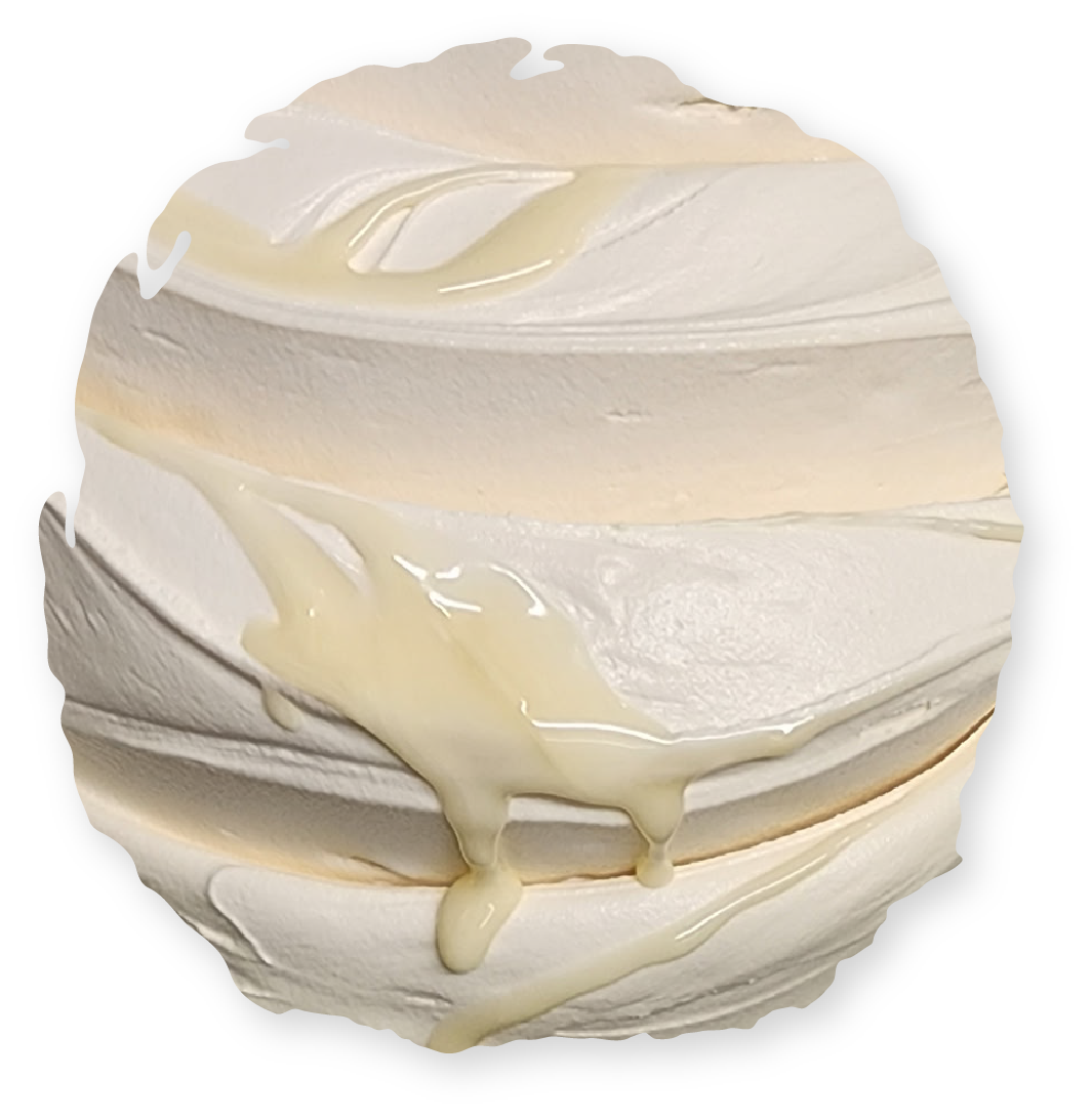 Swirled white cream with a drizzle of golden liquid.