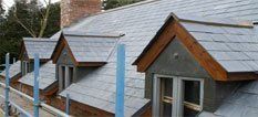 Slate roof with multiple roof windows