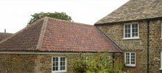 House with tiled roof extension