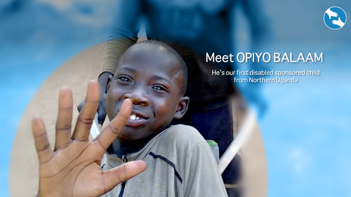Boy with dark skin smiles, raising his hand. Text: Meet Opiyo Balaam.