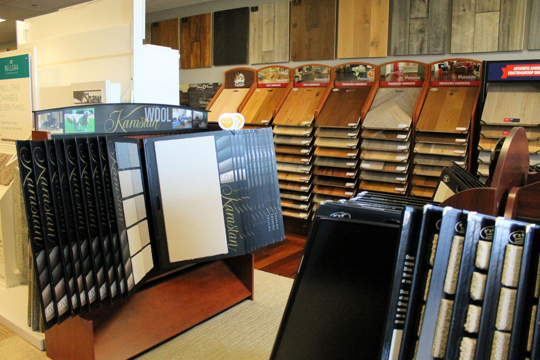 Flooring store displays samples of wood and tile in various shades and styles.