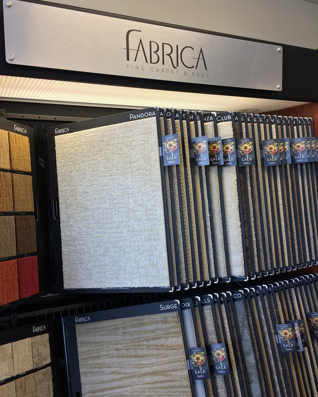 Carpet samples displayed in a showroom under the