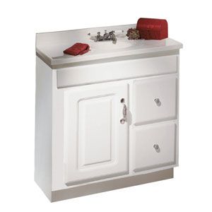 A white bathroom vanity with a sink and a towel on top of it.