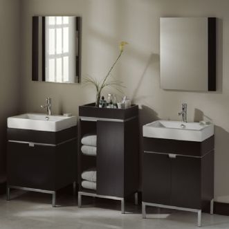 A bathroom with two sinks and a mirror