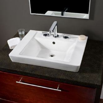 A bathroom sink with a mirror above it