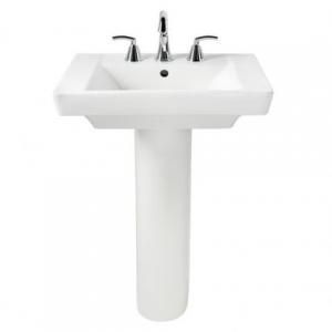 A white pedestal sink with a faucet on a white background.