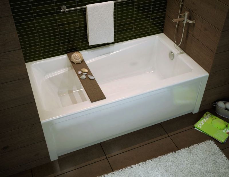 A bathtub with a tray on top of it in a bathroom.