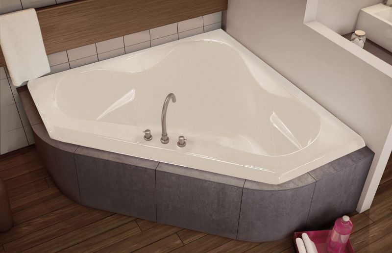 A white bathtub is sitting in a bathroom next to a sink.