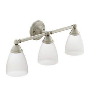 A bathroom vanity light with three clear glass shades.