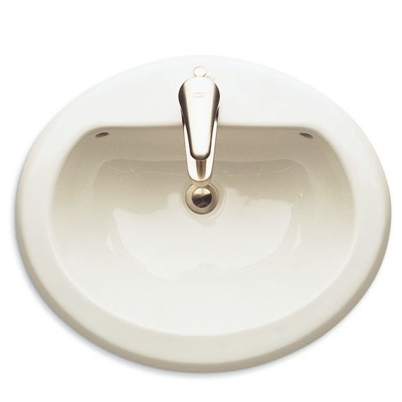 A white bathroom sink with a chrome faucet