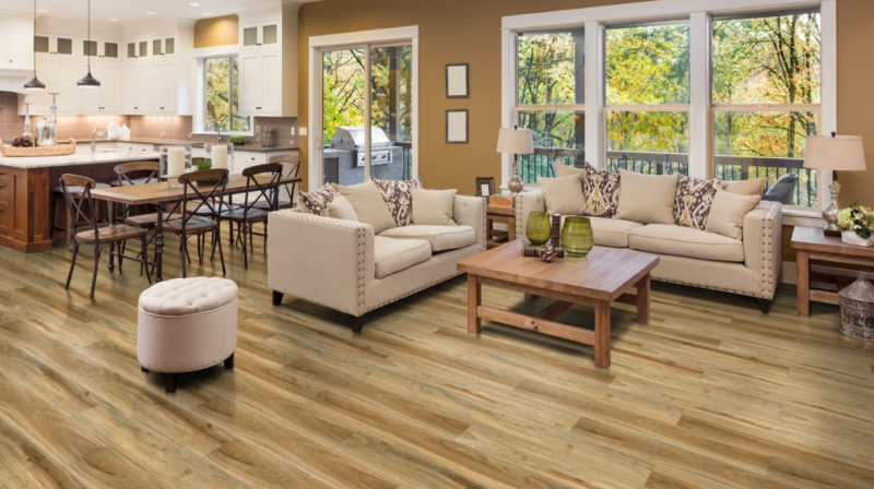 A living room with hardwood floors , two couches , a table and chairs.