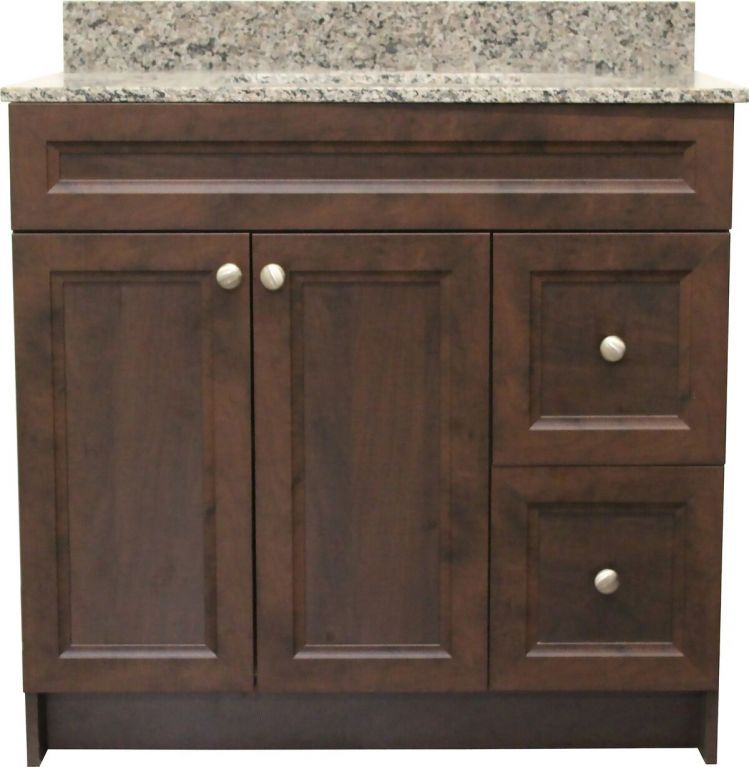 A bathroom vanity with a granite counter top