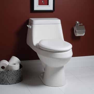 A white toilet is sitting next to a basket of toilet paper in a bathroom.