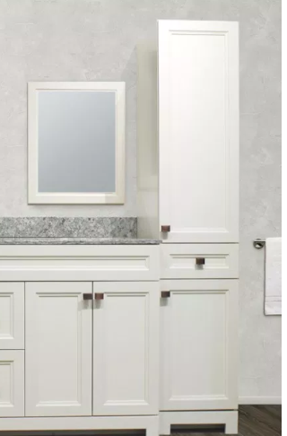 A bathroom with white cabinets , a sink , a mirror and a tall cabinet.