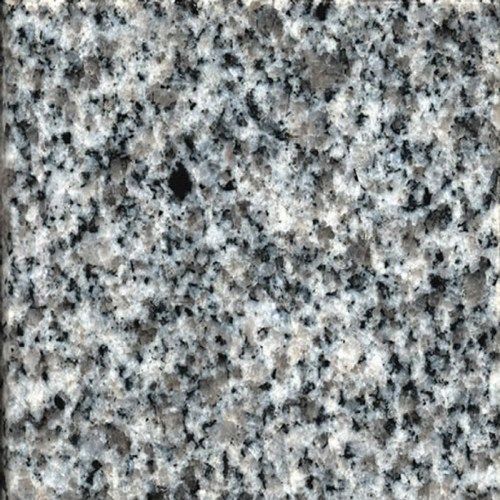 A close up of a gray granite counter top.