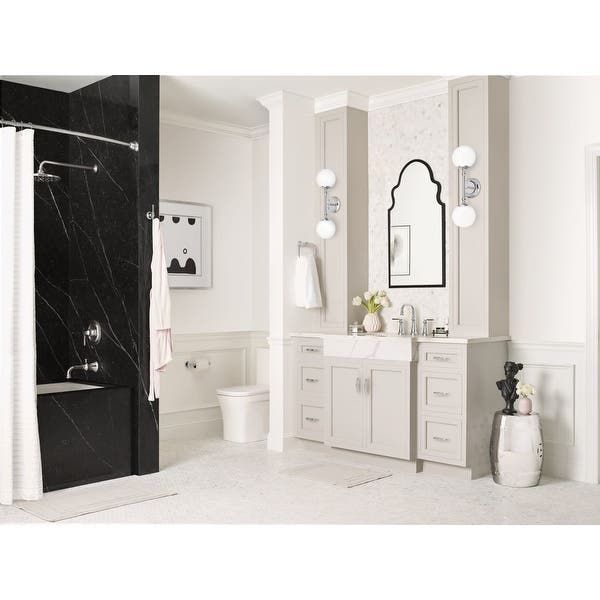 A bathroom with a sink a toilet and a shower