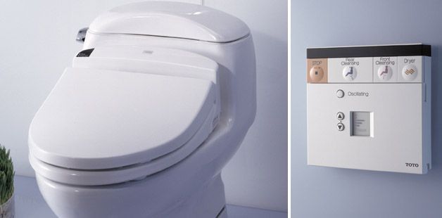 A white toilet next to a white box with the letter c on it