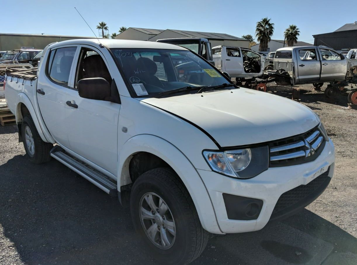 A White Pickup Truck Is Parked In A Lot — Scott's 4WD Parts Plus In Cobar, NSW