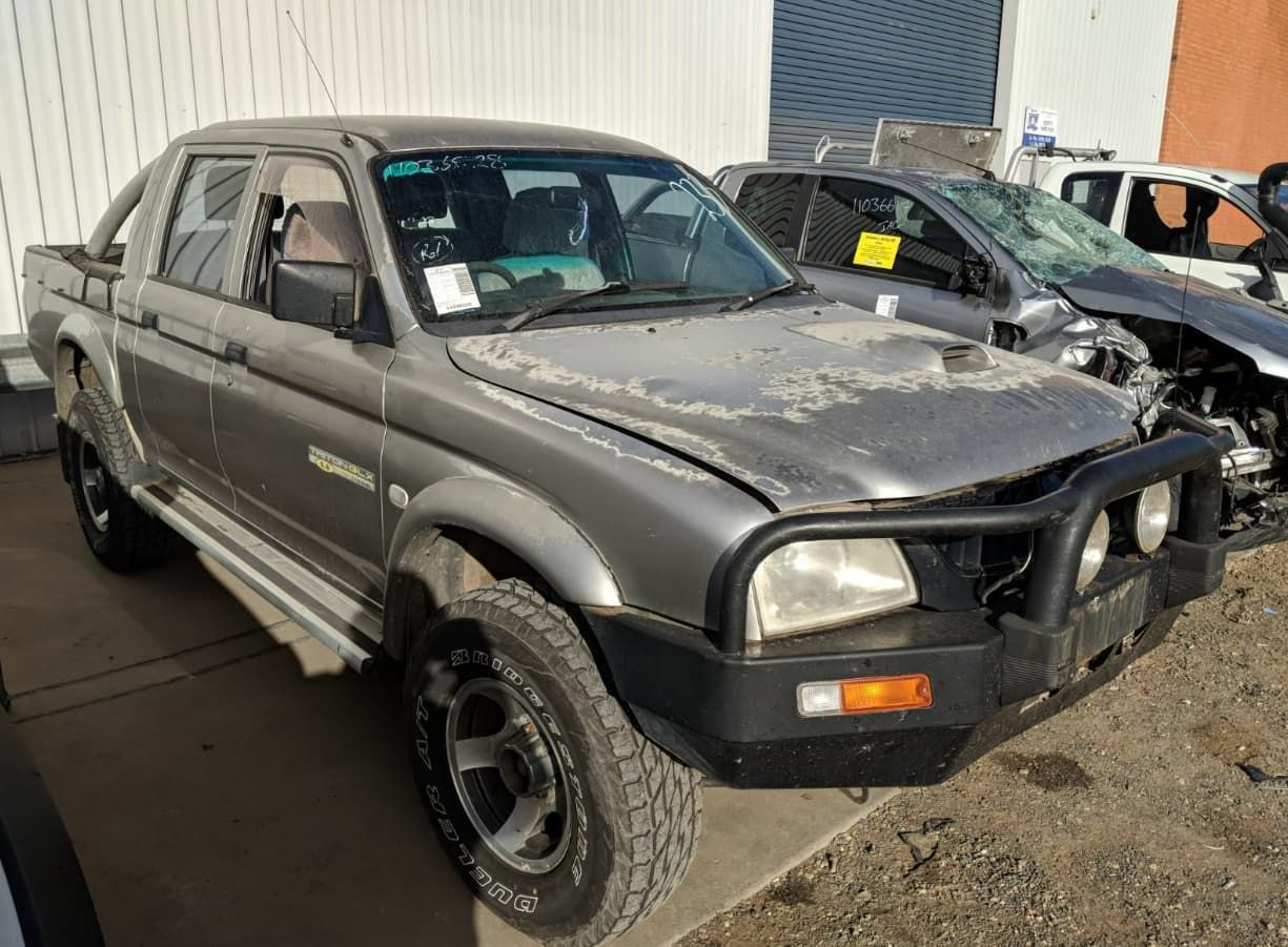 A Gray Truck Is Parked In Front Of A Building — Scott's 4WD Parts Plus In Tamworth, NSW