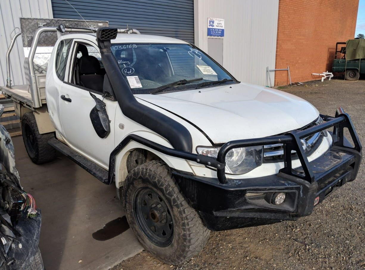 A White Truck With A Snorkel Is Parked In Front Of A Building — Scott's 4WD Parts Plus In Wagga Wagga, NSW