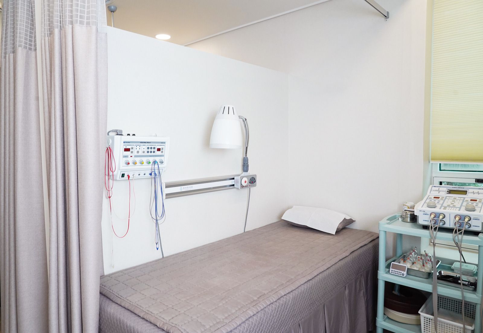 Woman cleaning floor, green bucket of cleaning supplies in foreground.
