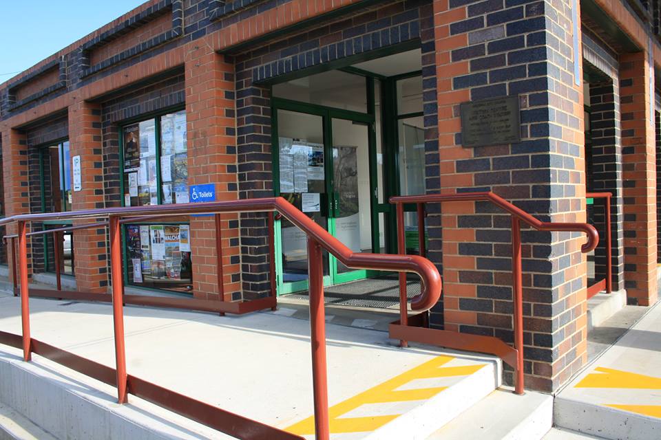 steel handrails alongside stairs in front of building
