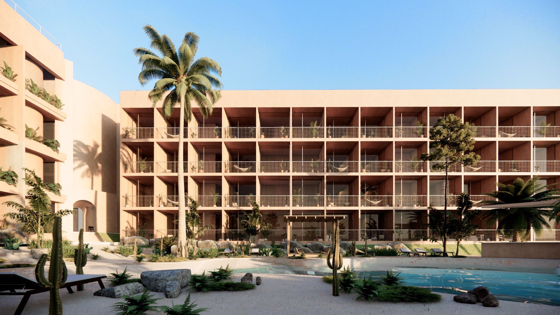 Hotel courtyard with pool, palm tree, and three-story building with balconies; desert landscape.