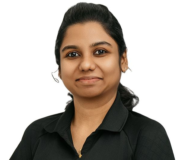 A person with dark hair tied back wears a black polo shirt and a smartwatch, posing against a white background.
