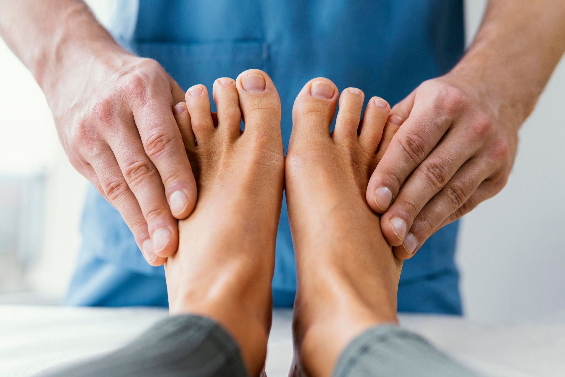 A person is getting a foot massage from a doctor.